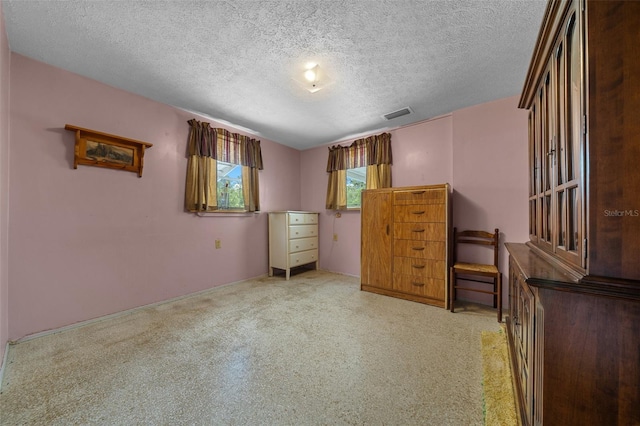 23737 NW Mallard Ave, Dunnellon, FL 34431 - bedroom featuring a textured ceiling, carpet floors, and visible vents