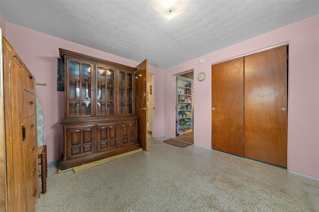 23737 NW Mallard Ave, Dunnellon, FL 34431 - unfurnished bedroom with a closet and a textured ceiling