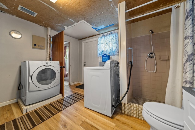 23737 NW Mallard Ave, Dunnellon, FL 34431 - washroom featuring laundry area, light wood-type flooring, and visible vents