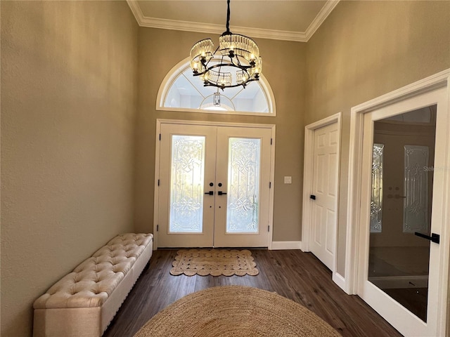 13430 NE 30th Ct, Anthony, FL 32617 - foyer with french doors, dark wood-style floors, a chandelier, ornamental molding, and baseboards