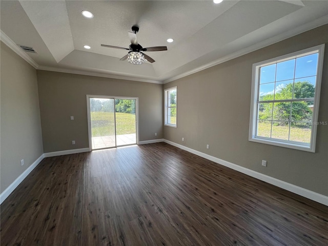 13430 NE 30th Ct, Anthony, FL 32617 - empty room featuring a raised ceiling, ornamental molding, baseboards, a ceiling fan, and dark wood-style floors
