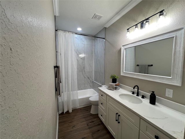 13430 NE 30th Ct, Anthony, FL 32617 - bathroom with a textured wall, wood finished floors, toilet, vanity, and shower / bathtub combination with curtain