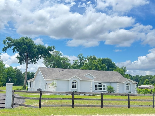 13430 NE 30th Ct, Anthony, FL 32617 - ranch-style house with stucco siding, roof with shingles, and an attached garage