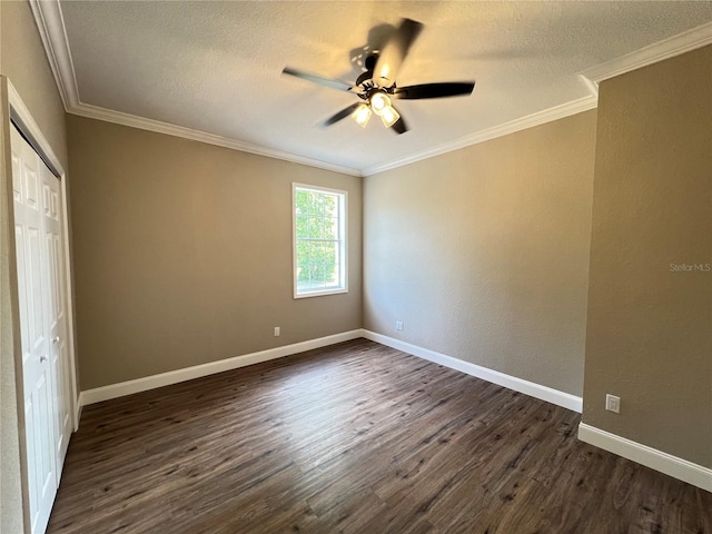 13430 NE 30th Ct, Anthony, FL 32617 - unfurnished bedroom with dark wood-style floors, a textured ceiling, a closet, crown molding, and baseboards
