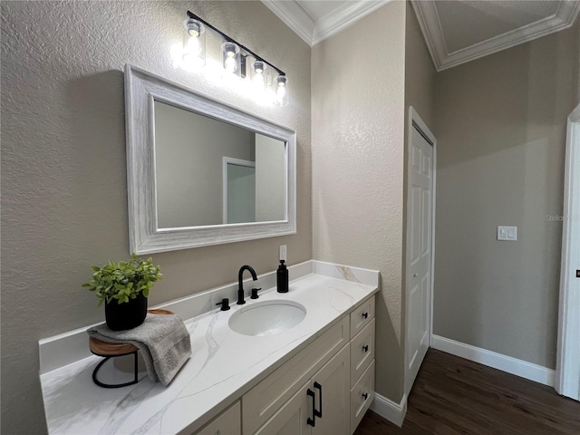 13430 NE 30th Ct, Anthony, FL 32617 - bathroom featuring a textured wall, crown molding, wood finished floors, vanity, and baseboards