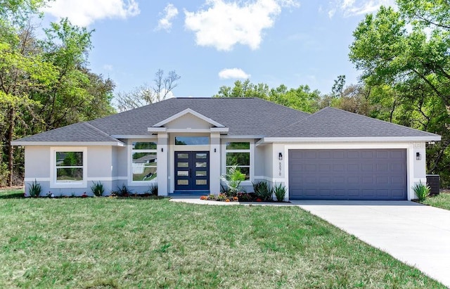 view of front of house with an attached garage, stucco siding, a shingled roof, a front lawn, and driveway