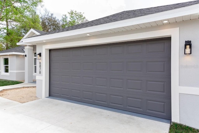 garage featuring driveway