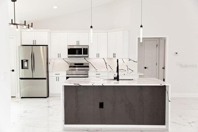 kitchen featuring marble finish floor, a sink, high vaulted ceiling, white cabinets, and appliances with stainless steel finishes