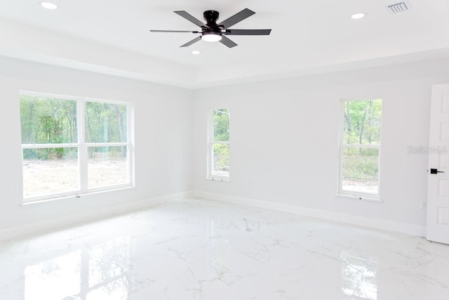 empty room featuring marble finish floor, baseboards, visible vents, and recessed lighting