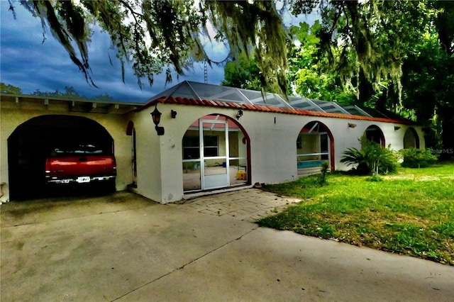 16850 SE 19th Ct, Summerfield, FL 34491 - view of front facade featuring stucco siding and concrete driveway