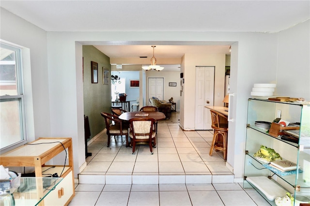 16850 SE 19th Ct, Summerfield, FL 34491 - dining room with a chandelier and light tile patterned flooring