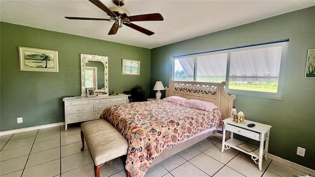 16850 SE 19th Ct, Summerfield, FL 34491 - bedroom featuring baseboards, light tile patterned floors, and ceiling fan