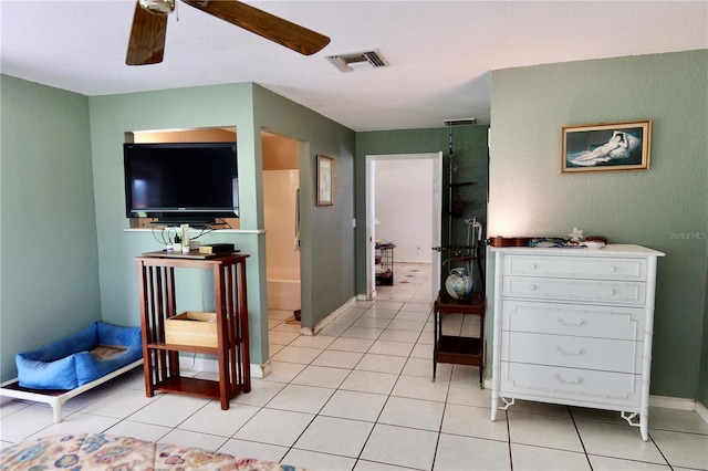 16850 SE 19th Ct, Summerfield, FL 34491 - bedroom featuring light tile patterned flooring, baseboards, and a ceiling fan