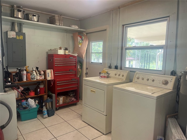 16850 SE 19th Ct, Summerfield, FL 34491 - washroom with electric panel, washing machine and dryer, and light tile patterned floors