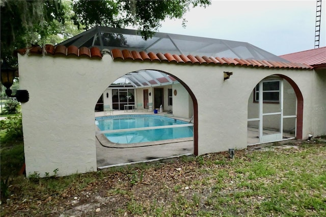 16850 SE 19th Ct, Summerfield, FL 34491 - rear view of house featuring an outdoor pool and stucco siding