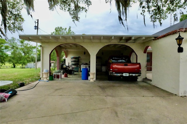 16850 SE 19th Ct, Summerfield, FL 34491 - view of parking with concrete driveway and a carport