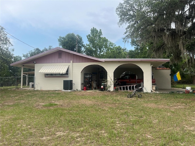 16850 SE 19th Ct, Summerfield, FL 34491 - rear view of house featuring central air condition unit