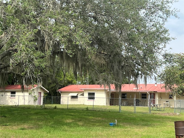 16850 SE 19th Ct, Summerfield, FL 34491 - back of property with stucco siding and metal roof