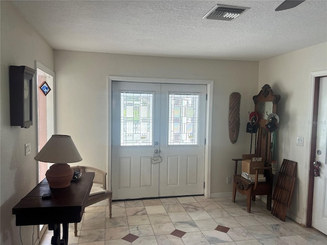 16850 SE 19th Ct, Summerfield, FL 34491 - foyer with a textured ceiling
