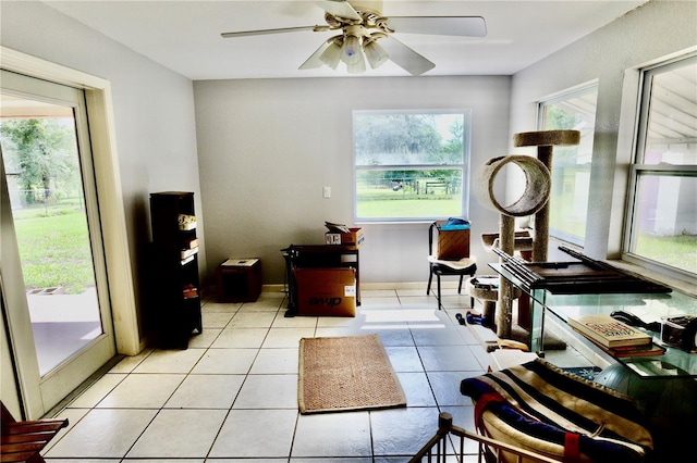 16850 SE 19th Ct, Summerfield, FL 34491 - sitting room with a ceiling fan and light tile patterned flooring
