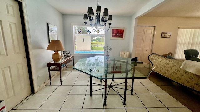 16850 SE 19th Ct, Summerfield, FL 34491 - dining room with a chandelier and light tile patterned flooring