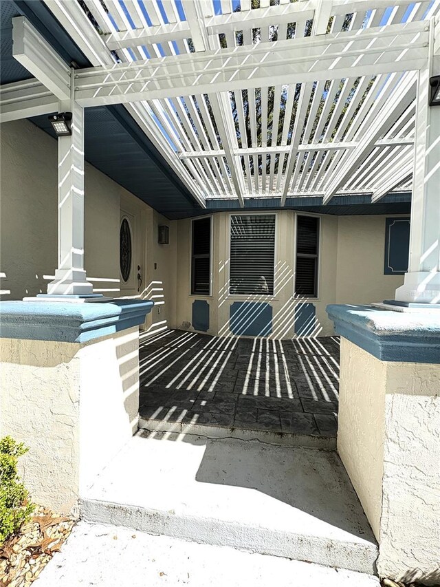 doorway to property with stucco siding