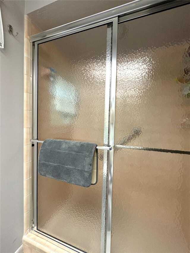 full bathroom with a shower stall