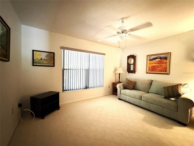 living room featuring a ceiling fan and carpet flooring