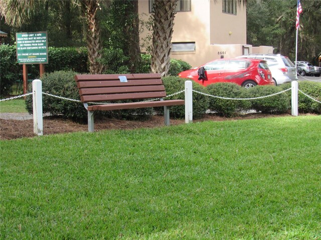 view of property's community featuring a yard