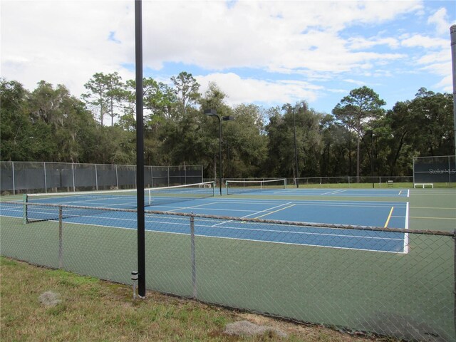 view of sport court with fence