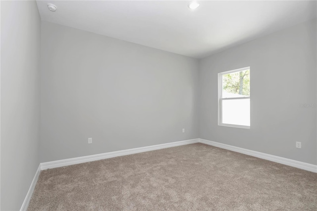 9405 SE 159th Ln, Summerfield, FL 34491 - carpeted empty room featuring baseboards and a smoke detector