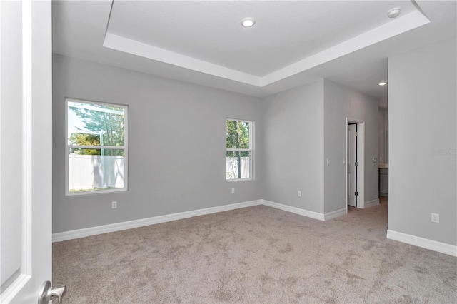 9405 SE 159th Ln, Summerfield, FL 34491 - carpeted spare room featuring a raised ceiling, baseboards, a smoke detector, and recessed lighting