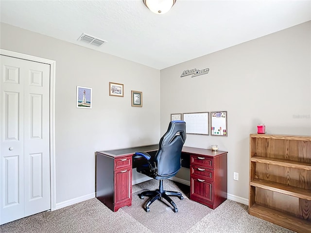 office space with light carpet and baseboards