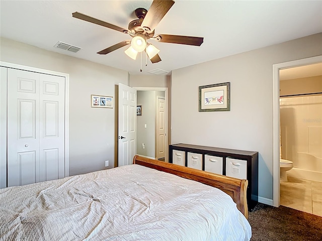 bedroom featuring carpet flooring, a closet, a ceiling fan, connected bathroom, and baseboards