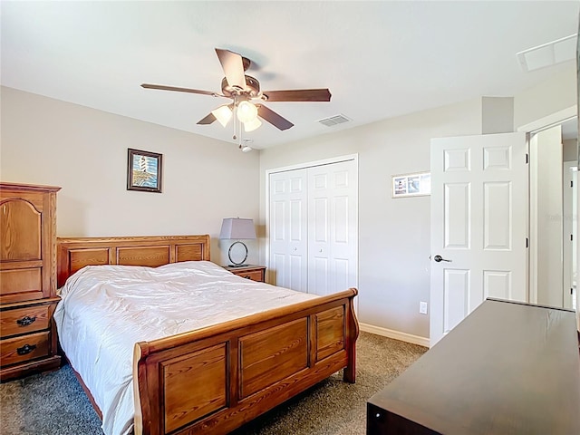 bedroom featuring dark colored carpet, a closet, a ceiling fan, and baseboards