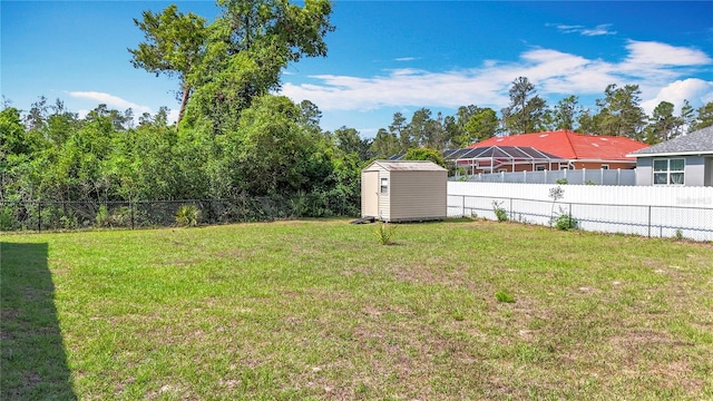 view of yard with a storage shed and an outbuilding