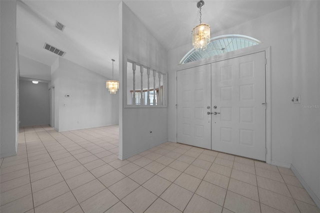 foyer with visible vents, a chandelier, and vaulted ceiling