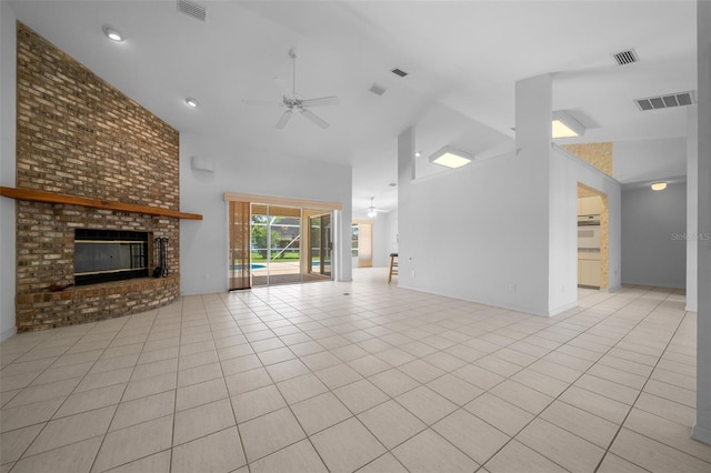 unfurnished living room with a ceiling fan, high vaulted ceiling, and visible vents