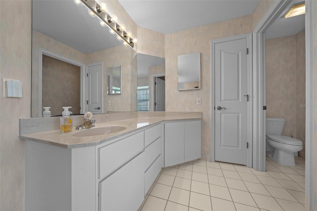 full bathroom featuring tile patterned floors, vanity, and toilet