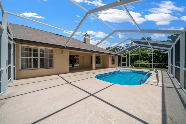 pool featuring a lanai and a patio area