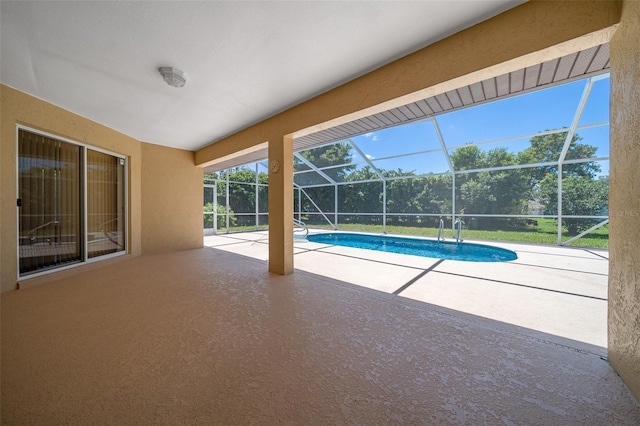 outdoor pool featuring a lanai and a patio area