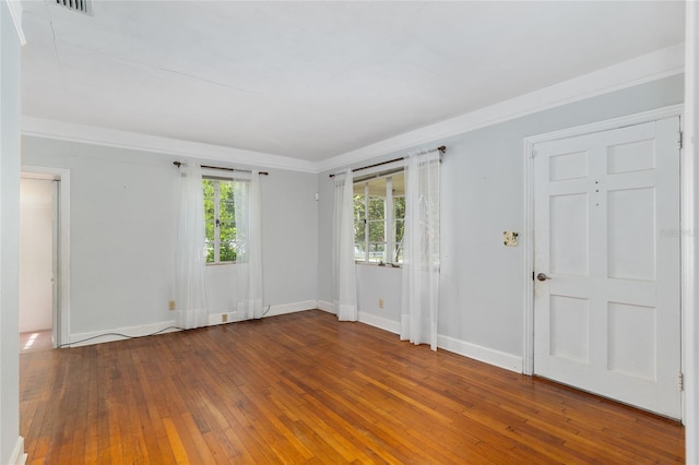 608 SE 31st Ter, Ocala, FL 34471 - spare room with crown molding, baseboards, and hardwood / wood-style flooring