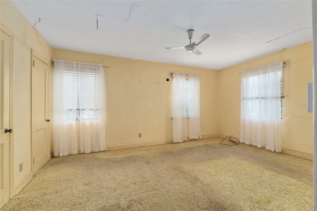 608 SE 31st Ter, Ocala, FL 34471 - unfurnished bedroom with multiple windows, baseboards, and carpet floors