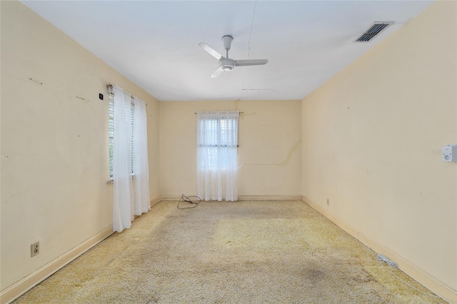 608 SE 31st Ter, Ocala, FL 34471 - spare room featuring ceiling fan, carpet floors, baseboards, and visible vents