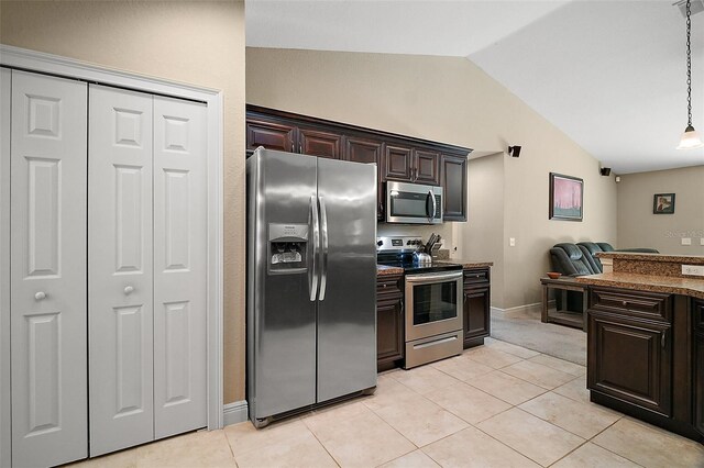 kitchen featuring light tile patterned floors, appliances with stainless steel finishes, dark brown cabinetry, and lofted ceiling