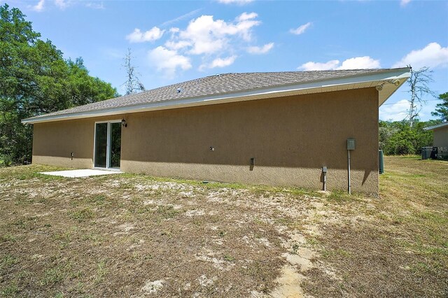 back of property with stucco siding