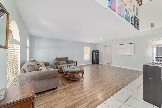 living room with light wood-type flooring, recessed lighting, baseboards, and visible vents
