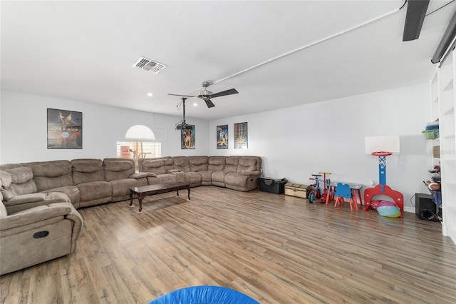 living area with visible vents, a ceiling fan, wood finished floors, and recessed lighting