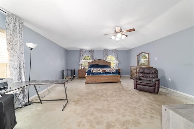 carpeted bedroom with baseboards and ceiling fan