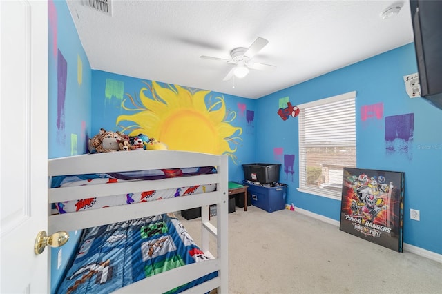 bedroom featuring carpet floors, baseboards, a ceiling fan, and visible vents